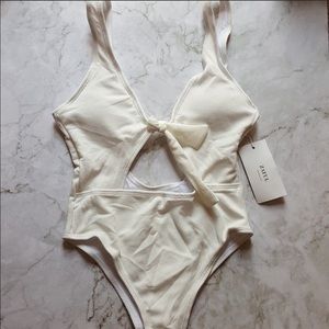 White one piece with cut outs!!